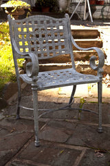 Cast Metal Table And Two Chairs